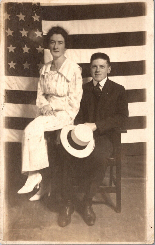 Real Photo Studio Postcard Portrait of Man and Woman with Giant American Flag