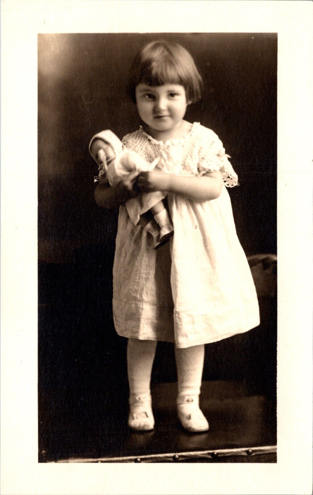 Real Photo Studio Postcard Little Girl Holding a Doll