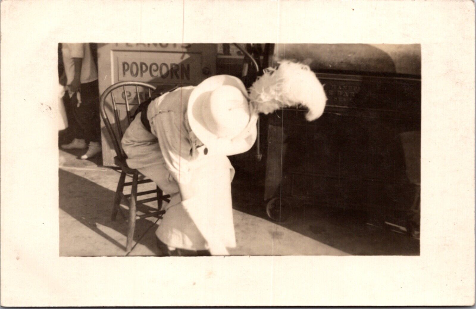 Real Photo Postcard Well Dressed Woman Sitting in a Chair at an Amusement Park