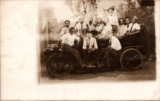 Real Photo Studio Postcard Group of Men Sitting in Early Open Air Automobile