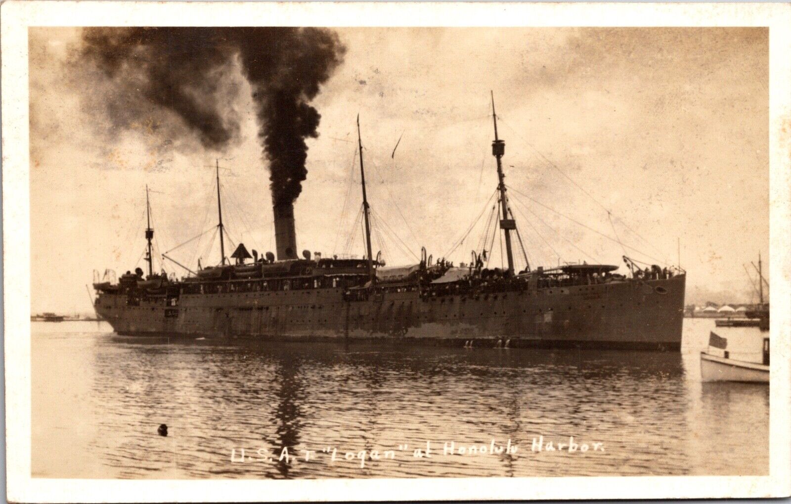 Real Photo Postcard U.S.A.T. Logan at Honolulu Harbor Military Supply Ship