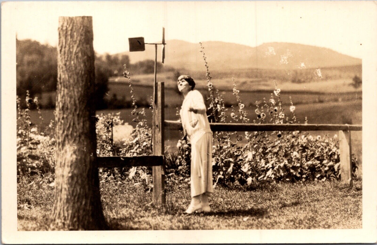 RPPC Mrs. Grace Coolidge wife of President Looking at Wind Spinner in Garden