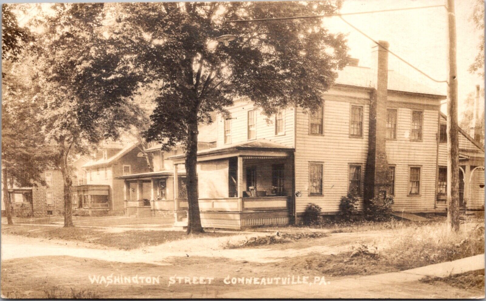 Real Photo Postcard Washington Street in Conneautville, Pennsylvania