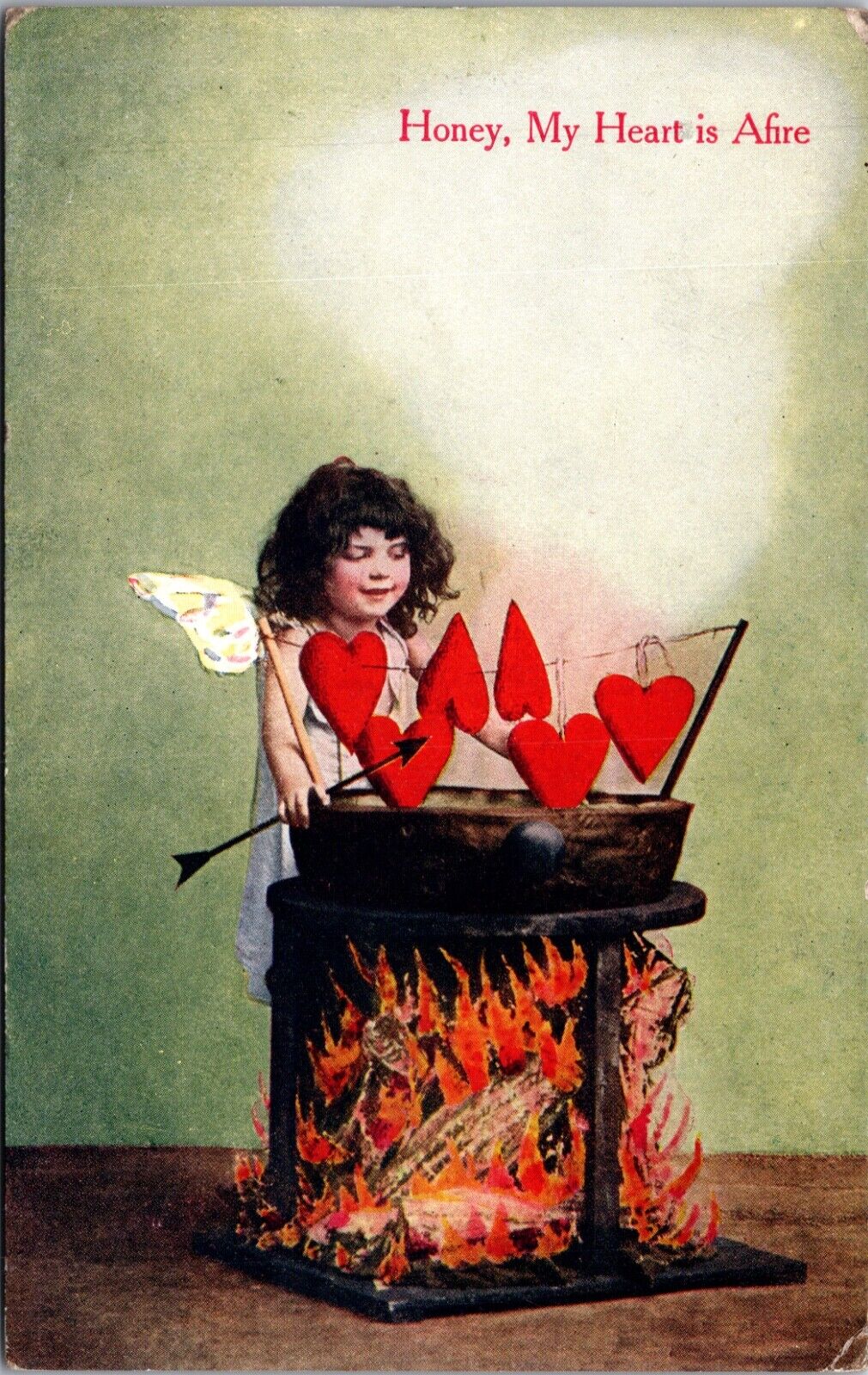 Valentine Postcard Girl Wearing Wings Cooking Hearts on String over a Fire