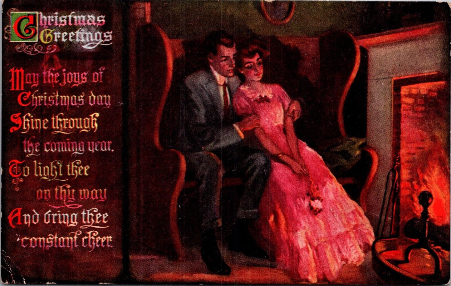 Christmas Greetings Postcard Man and Woman Snuggling by a Fireplace