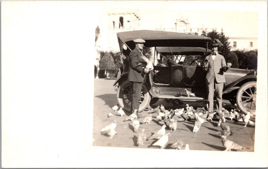 RPPC Early Automobiles Two Men Feeding Pigeons Balboa Park San Diego Exposition