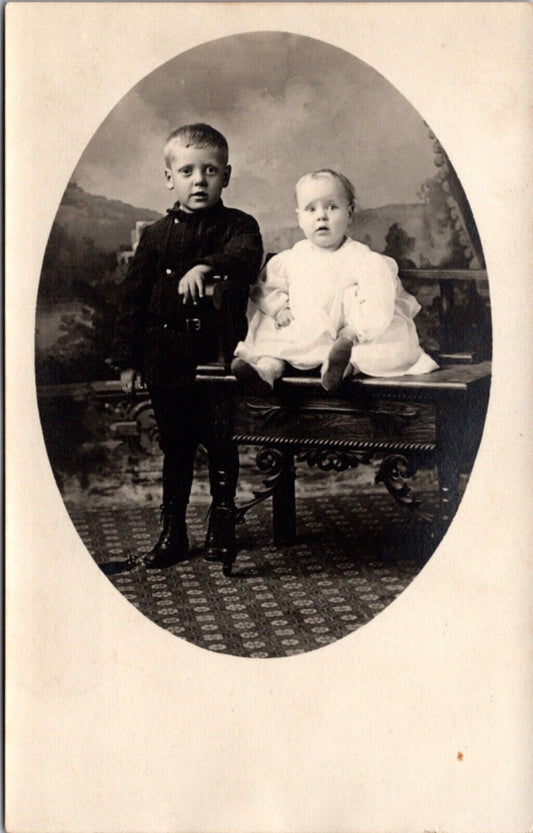 Real Photo Studio Postcard Baby and Toddler Children Child Sitting on Desk/Table