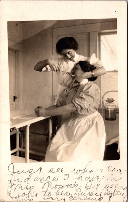 Real Photo Postcard Two Women Nurses Joking About Pulling a Tooth