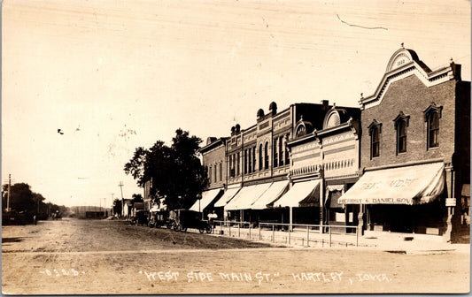 Real Photo Postcard West Side of Main Street in Hartley, Iowa