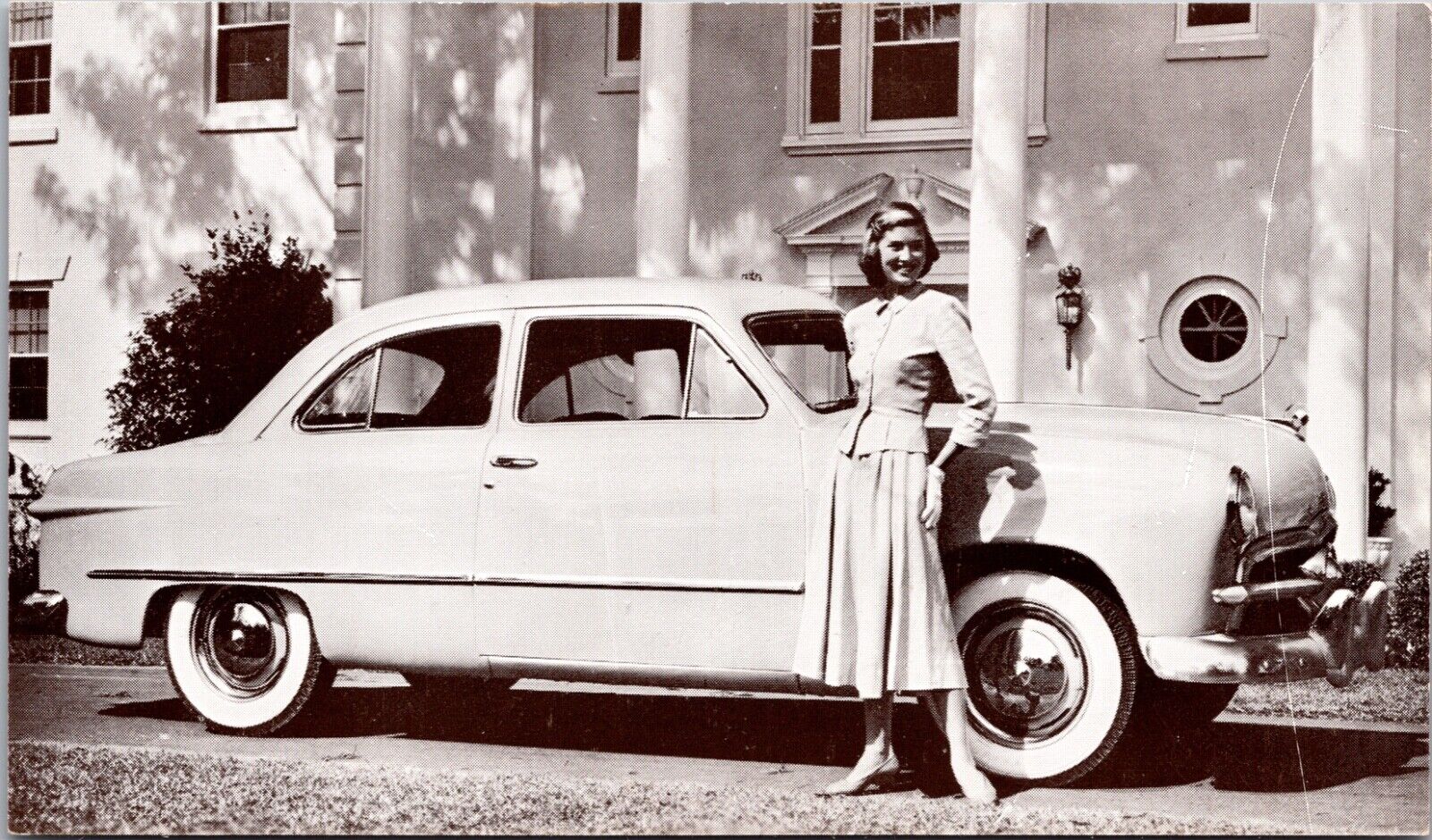 Advertising Postcard Woman with 1949 Ford 2-Door Sedan Automobile