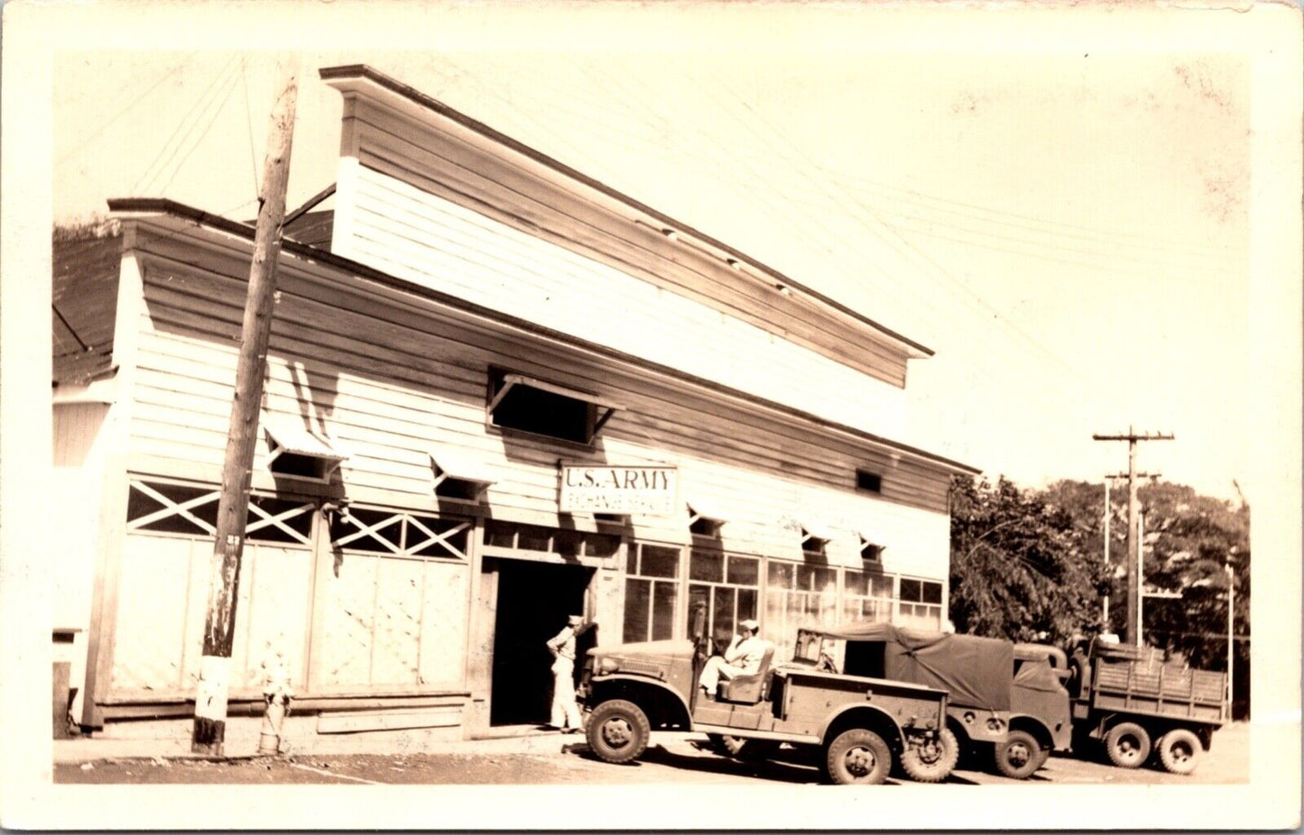 Real Photo Postcard U.S. Army Exchange Service in Hawaii Soldiers and Trucks