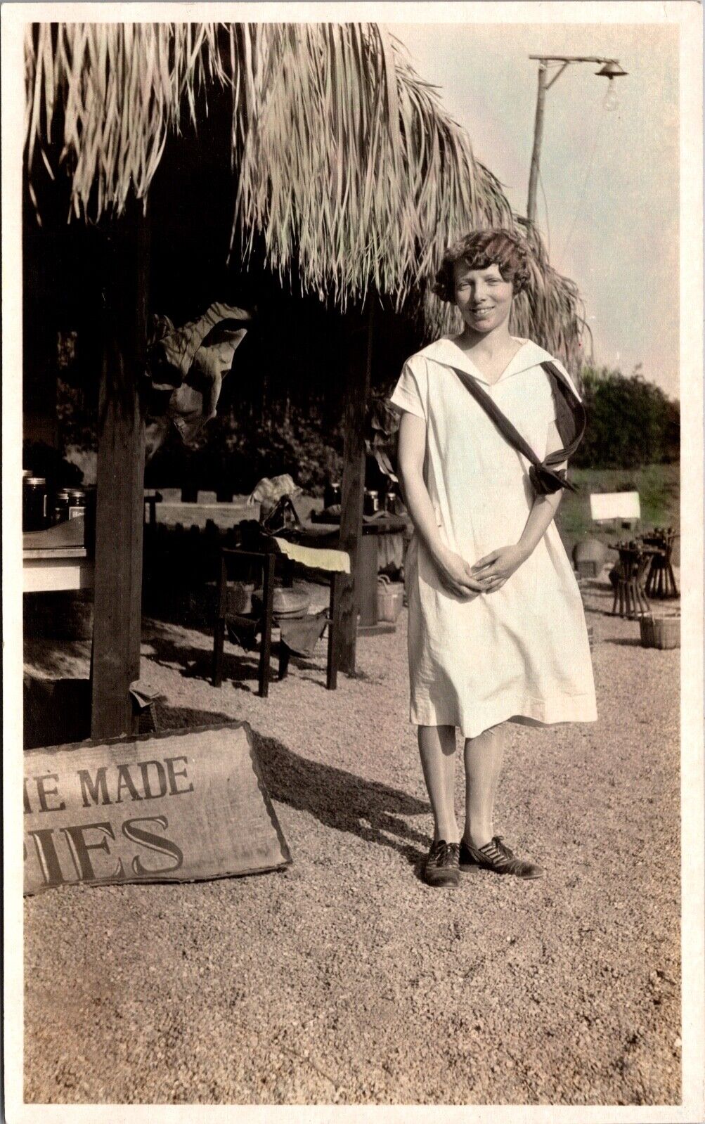 Real Photo Postcard Woman Next to Roadside Palapa Stand Home Made Pies