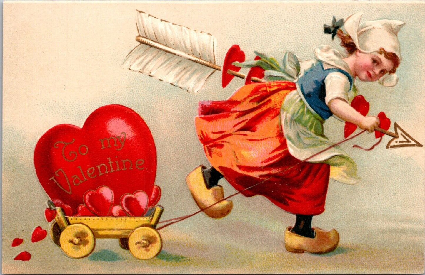 Valentine PC Dutch Girl with Hearts on Large Arrow Pulling Heart Filled Wagon