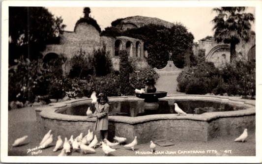 Real Photo Postcard Young Girl Doves Mission San Juan Capistrano, California