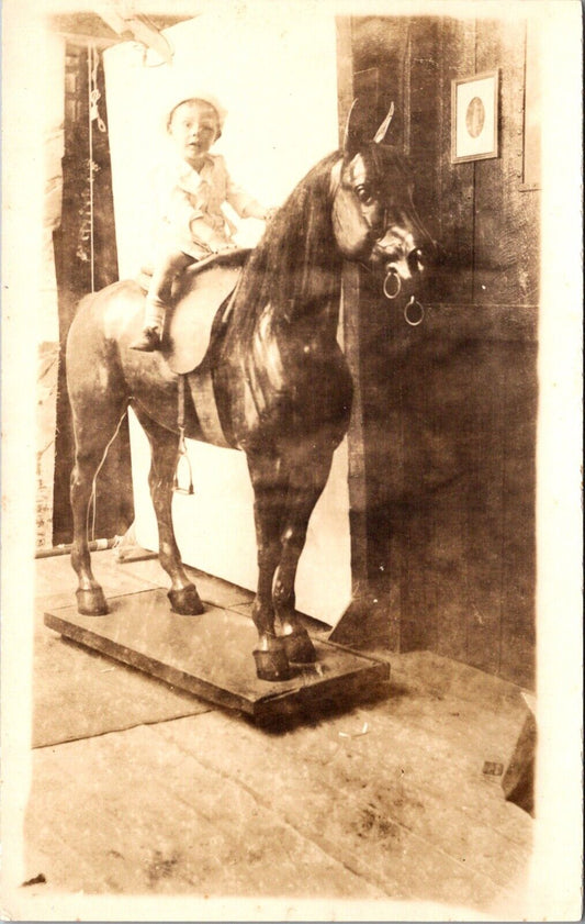 Real Photo Postcard Young Child Sitting Riding on Statue of Horse