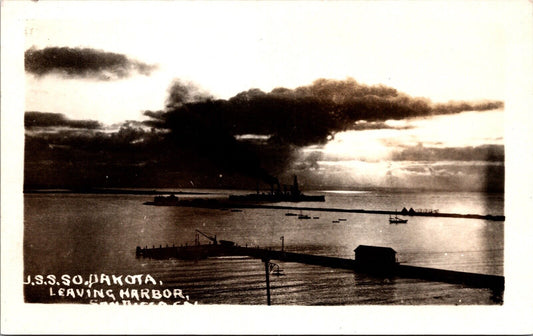 Real Photo Postcard U.S.S. South Dakota leaving harbor in San Diego, California