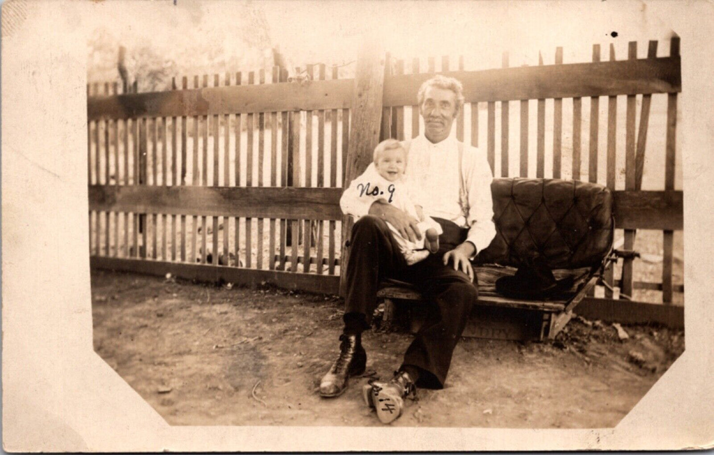 RPPC Man Holding Baby in Lap Sitting on Carriage Seat Outside Bremen, Kansas