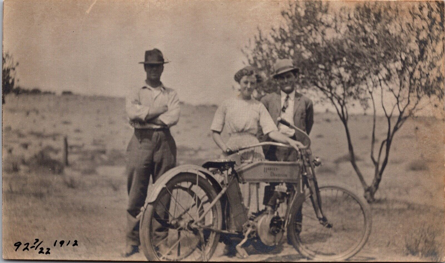 Ruth Olmstead & Charlie Rooker in Field with 1912 Harley Davidson Motorcycle