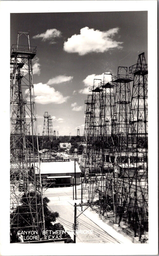 RP Postcard Canyon Between Oil Derricks, Hercules Supply Co in Kilgore, Texas